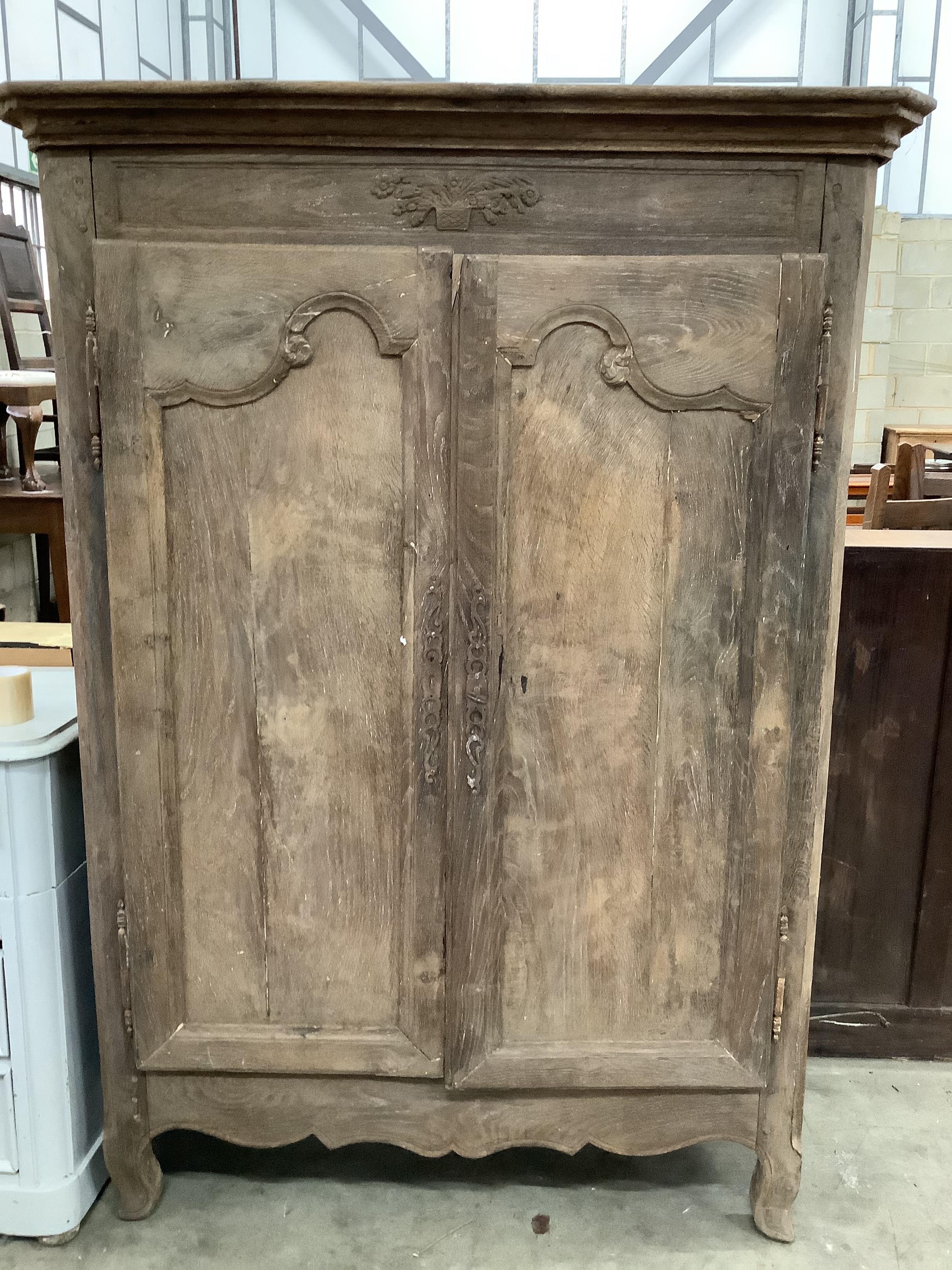 A 19th century French oak two door cupboard with painted interior, width 117cm, depth 55cm, height 162cm